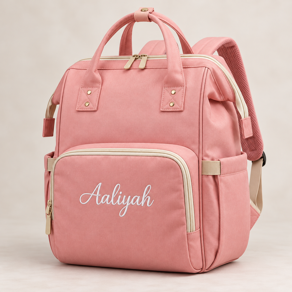 Pink diaper bag with name embroidered on front