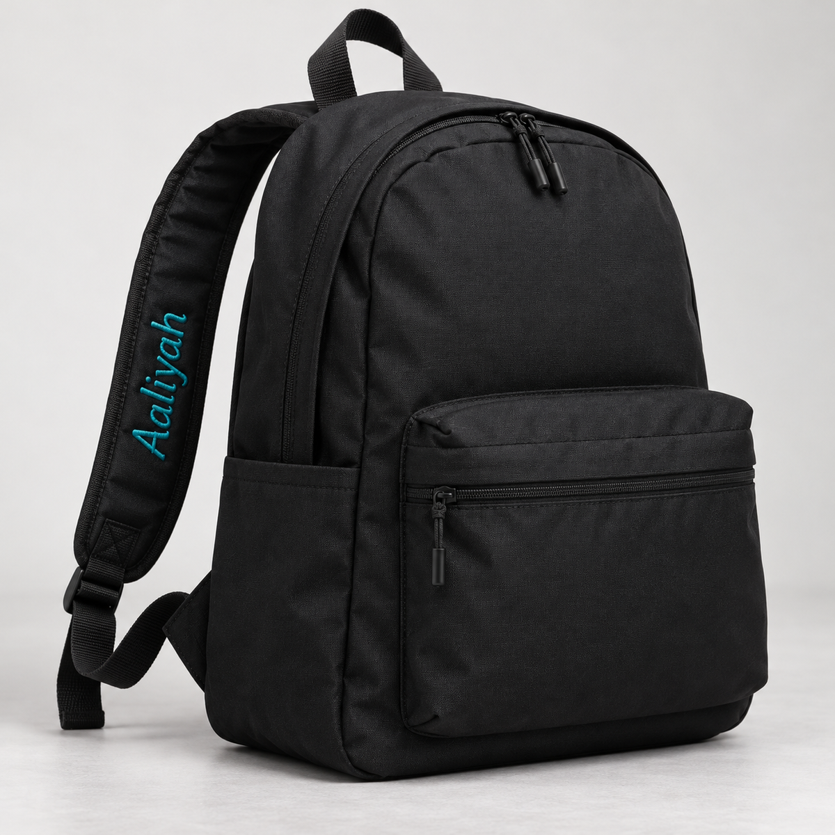 Name embroidered on backpack strap