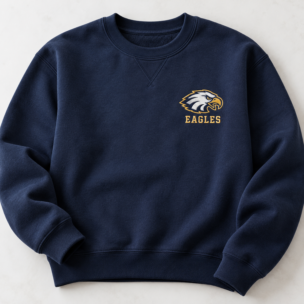 Navy crewneck with sample Eagles school logo