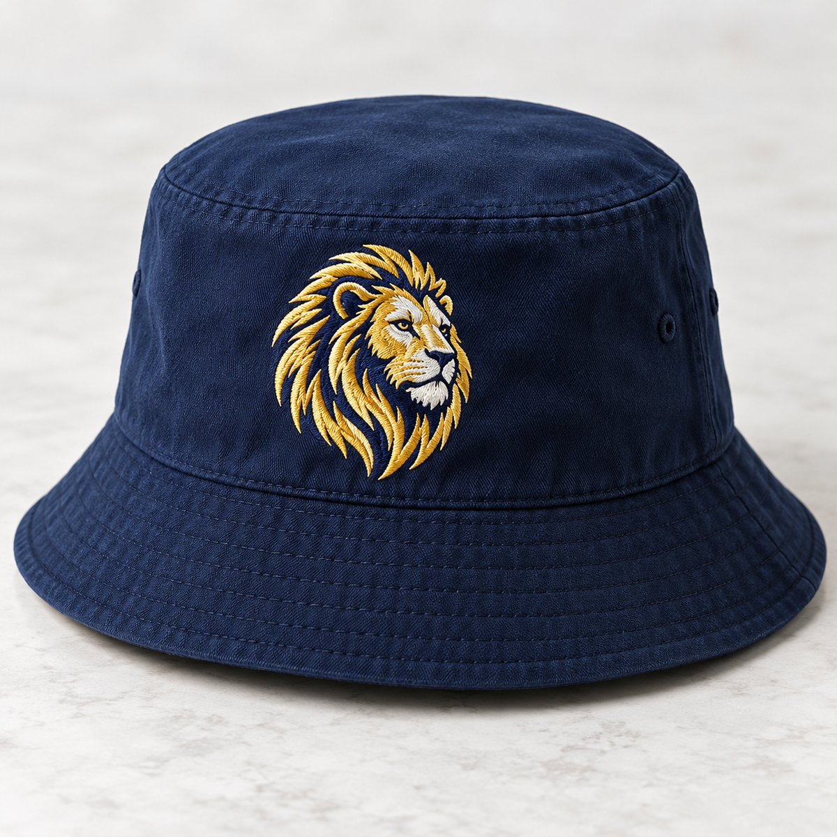 Navy bucket hat with gold and white embroidered lion logo